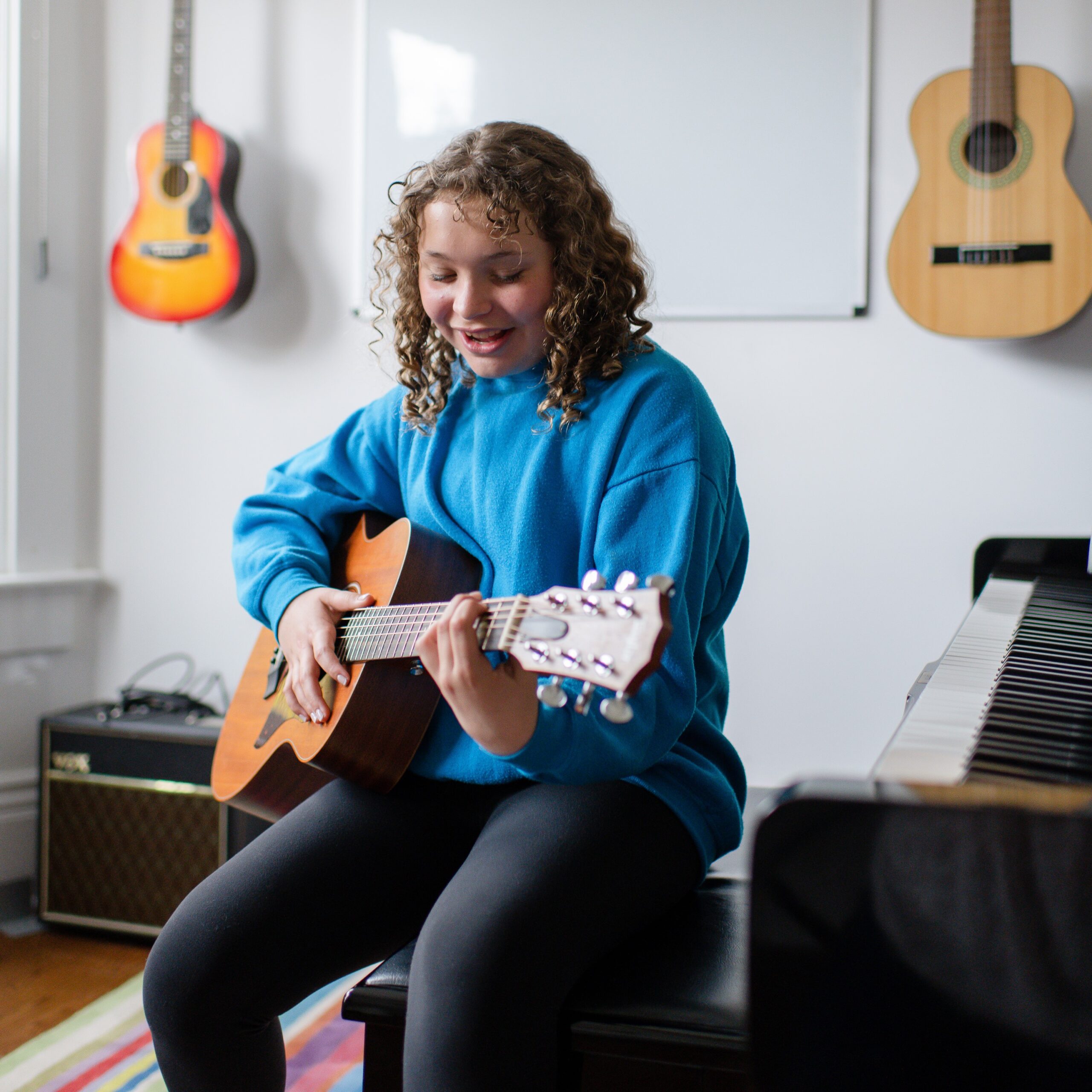 student playing guitar