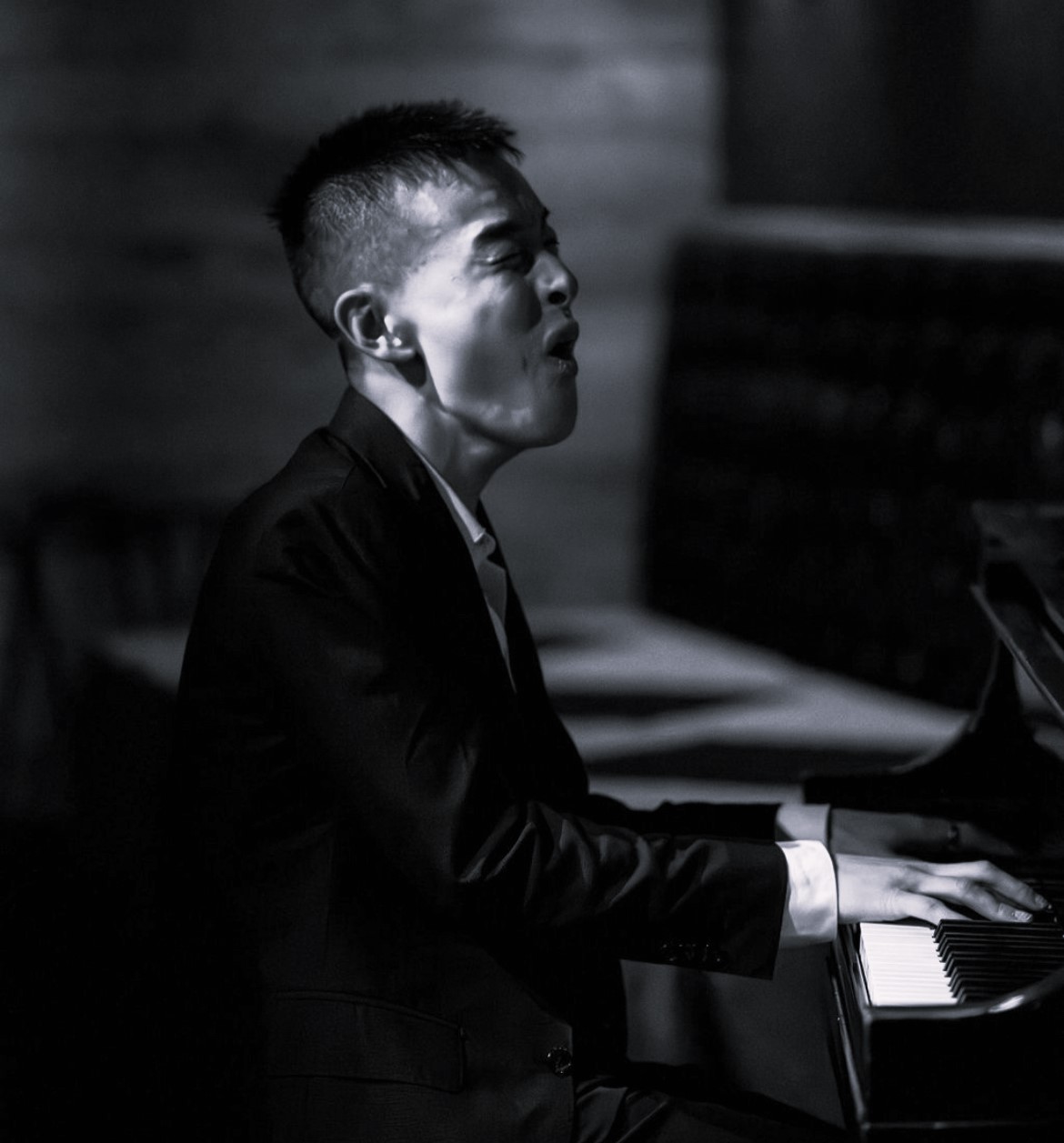 eric playing piano (black and white)